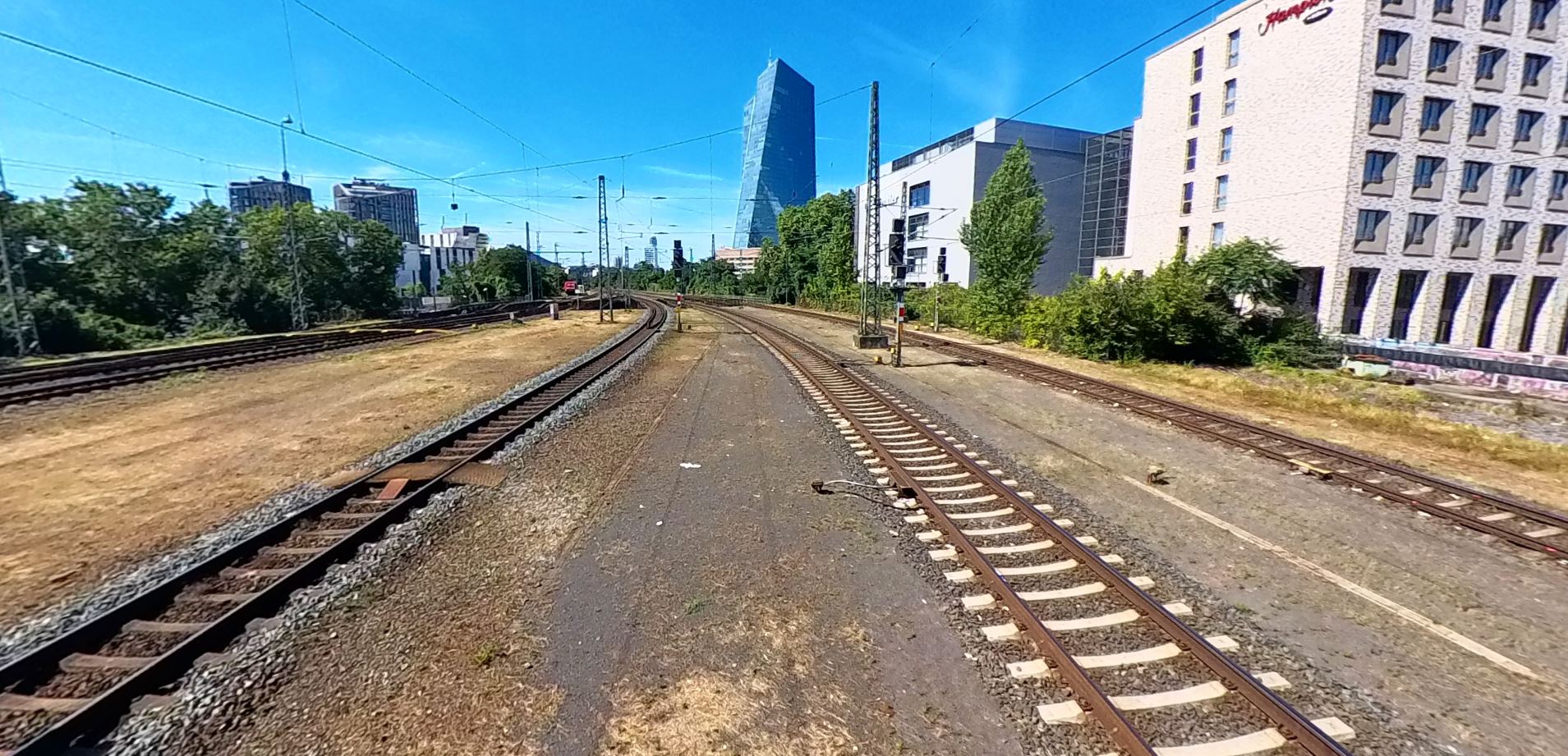 rail tracks with a blue sky in the background